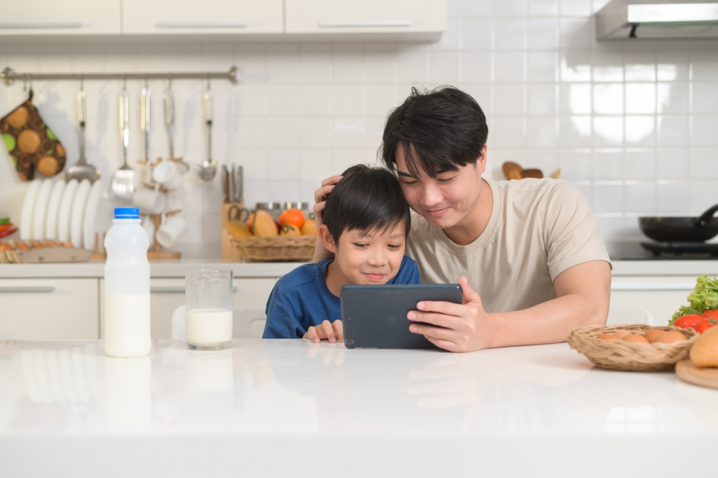 Father and son enjoying tablet together indoors 2026 01 07 01 40 41 utc